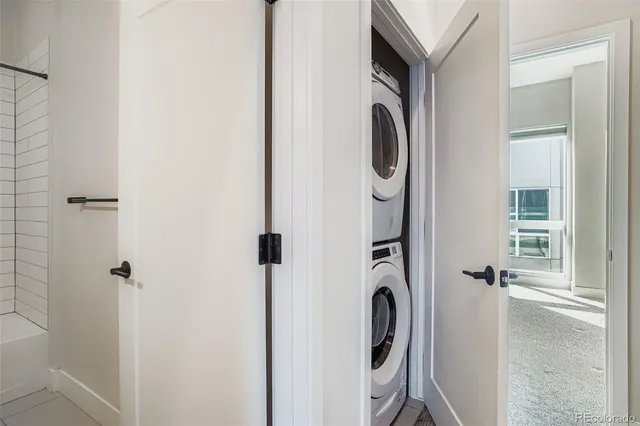 a bathroom with a granite countertop mirror and a shower