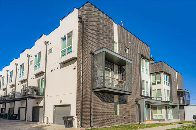a large building with a clock on the wall