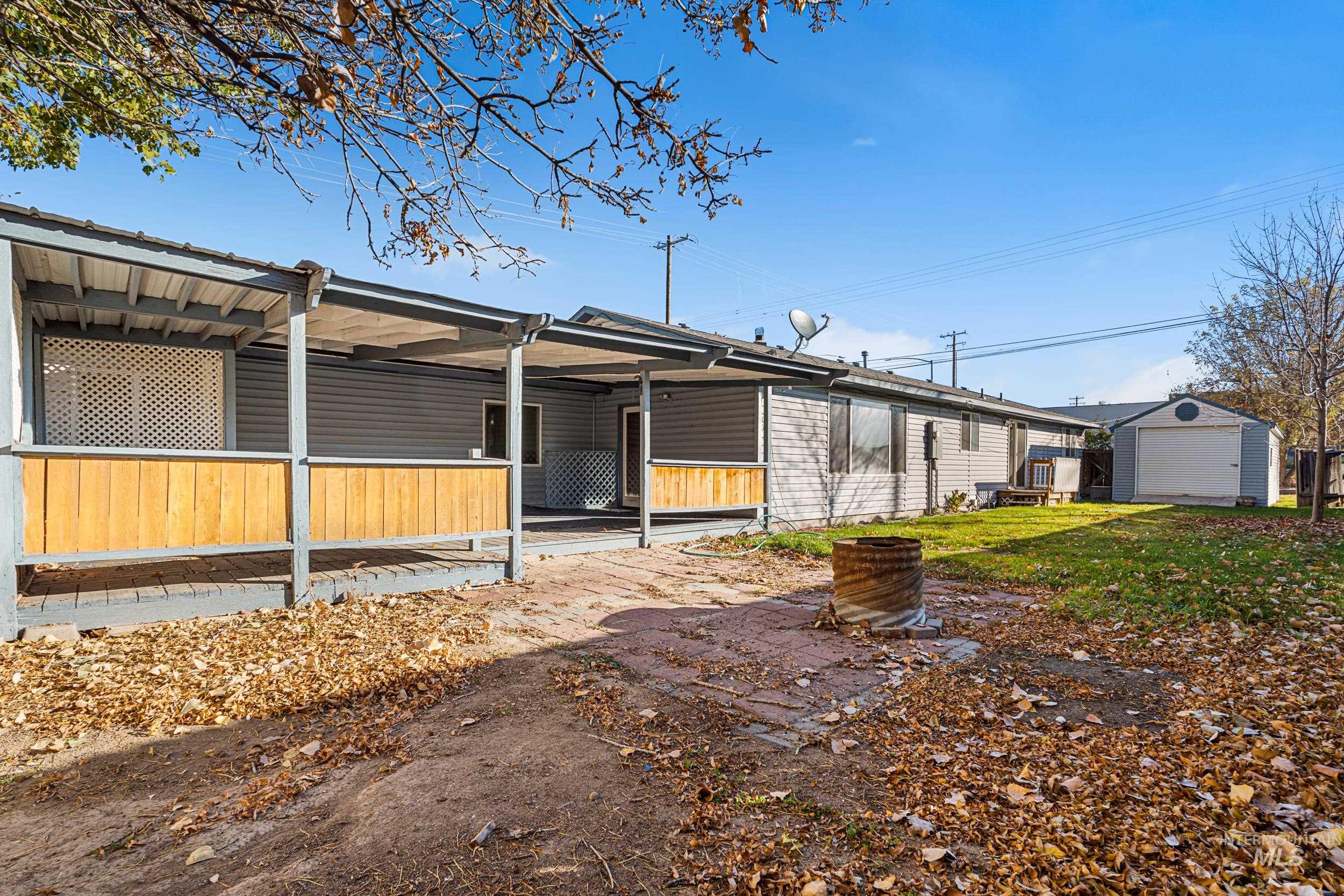 1212 East Ustick Road Caldwell, ID 83607 - Photo 46 of 50 View of back of property featuring an outbuilding and a backyard