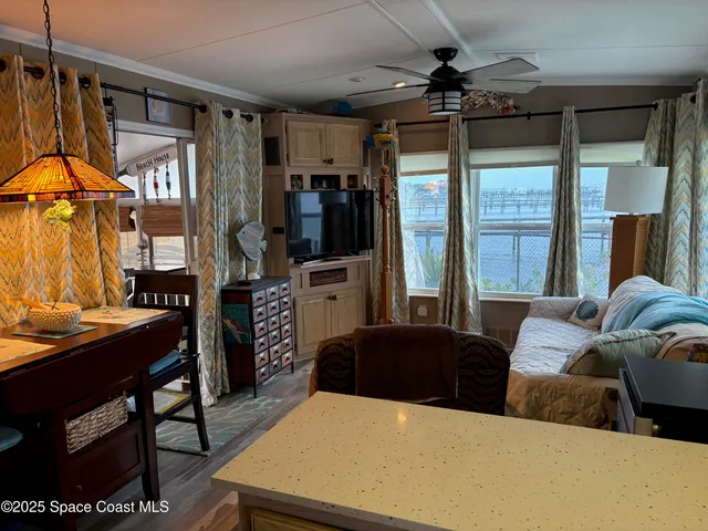 a front view of a house with garden and plants