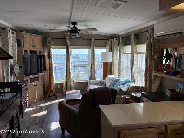 a room with furniture and a flat screen tv