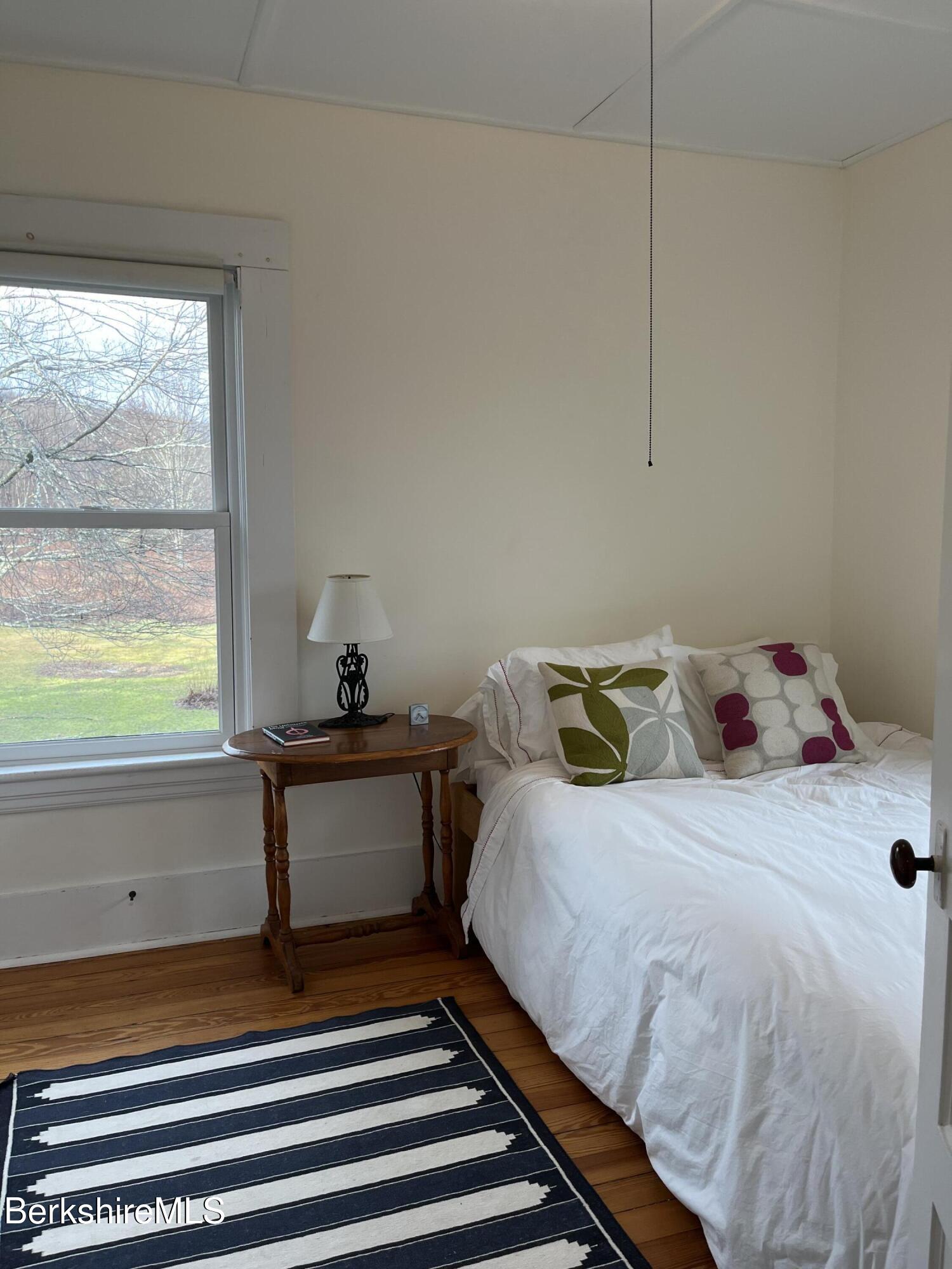 86 Miner Road Lanesborough, MA 01237 - Photo 39 of 44 a bedroom with a bed and a window