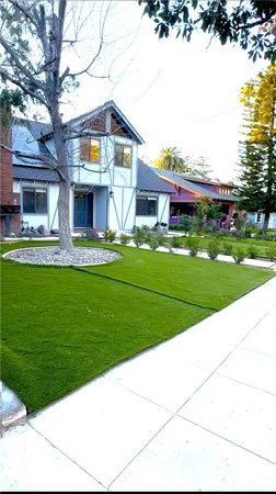 a front view of a house with garden