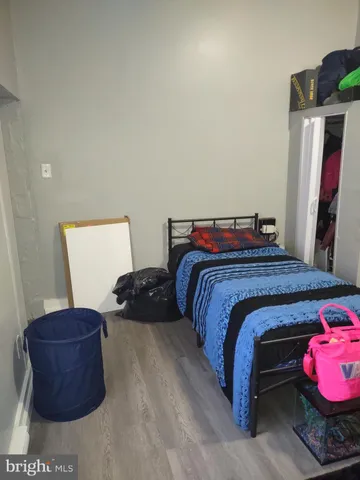 a bedroom with a bed and dresser