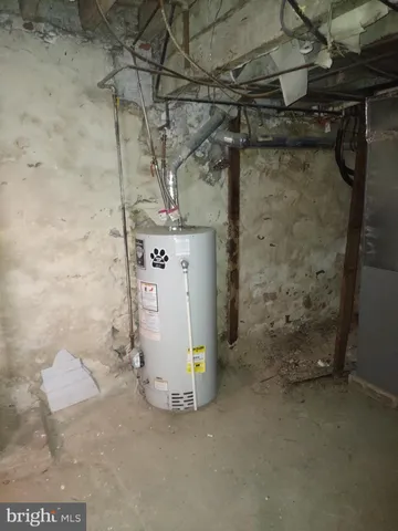 a utility room with a wooden floor