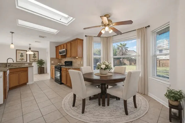 a spacious bedroom with a bed a couch and a window