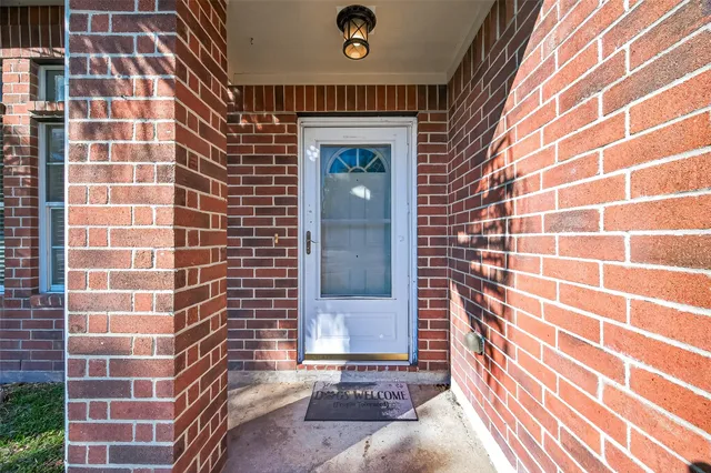 a view of a livingroom with furniture and chandelier fan