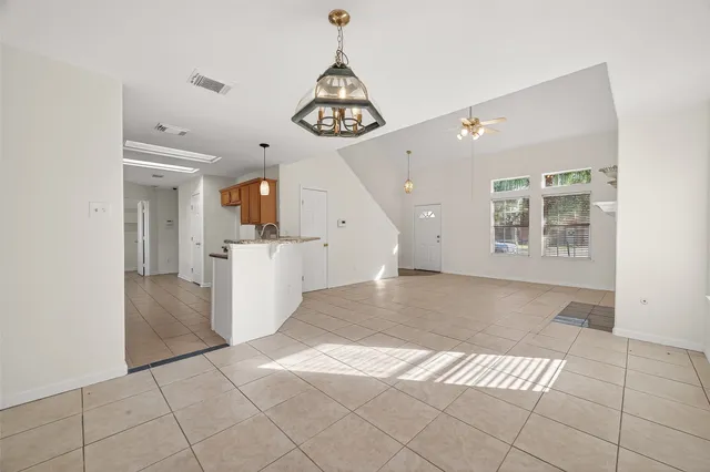 a kitchen with stainless steel appliances granite countertop a stove and a microwave
