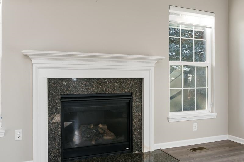 104 Reston Court Sycamore, IL 60178 - Photo 15 of 41 a white building with a fireplace