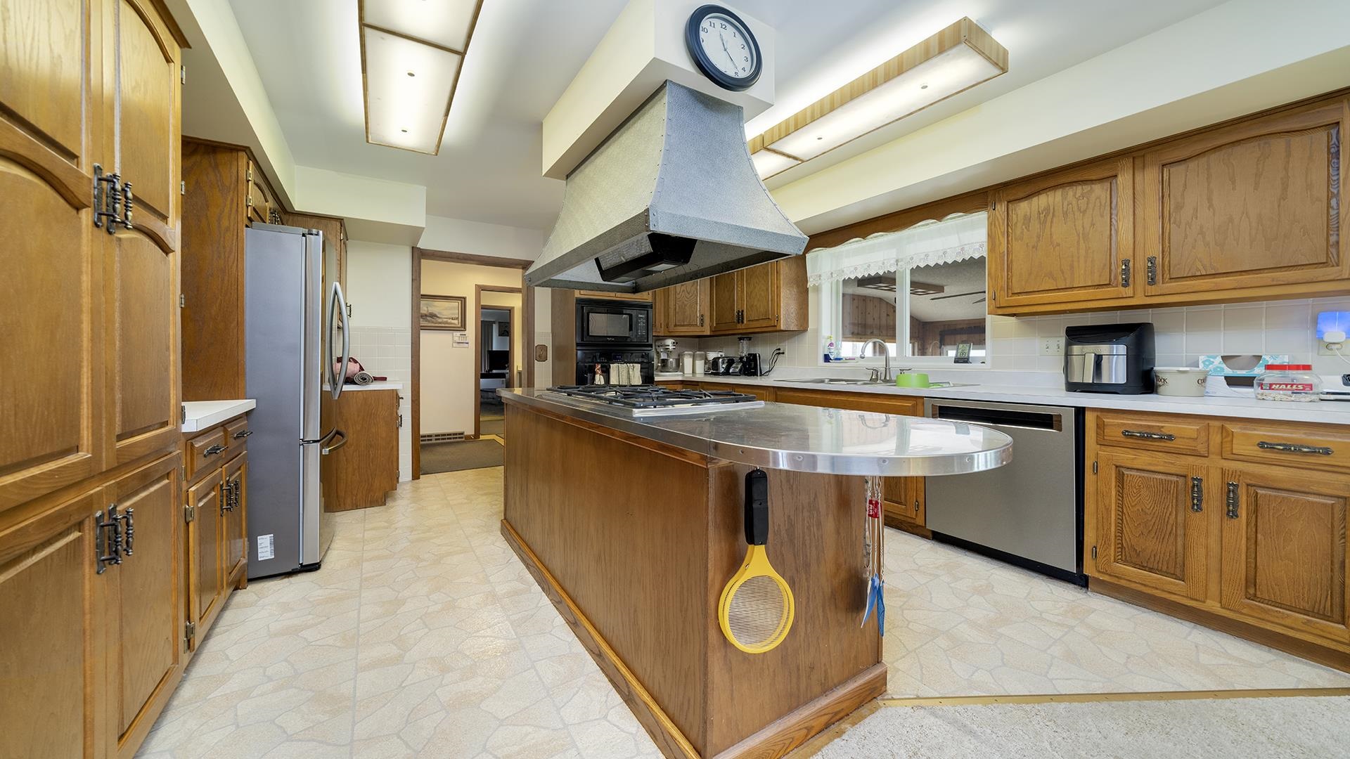 10245 West Penn Corner Road Polo, IL 61064 - Photo 11 of 48 a kitchen with stainless steel appliances granite countertop a sink dishwasher stove and refrigerator