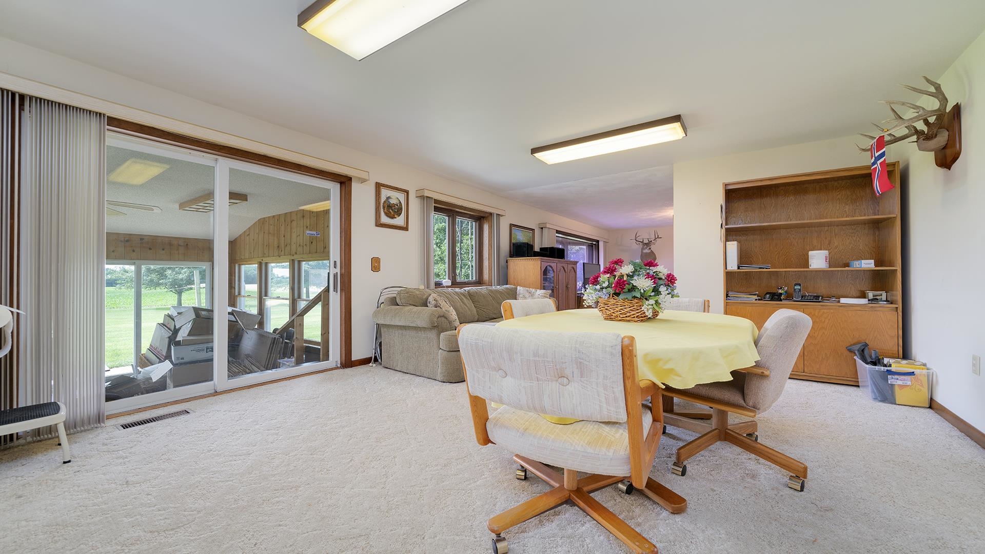 10245 West Penn Corner Road Polo, IL 61064 - Photo 15 of 48 a view of a livingroom with dining room and furniture