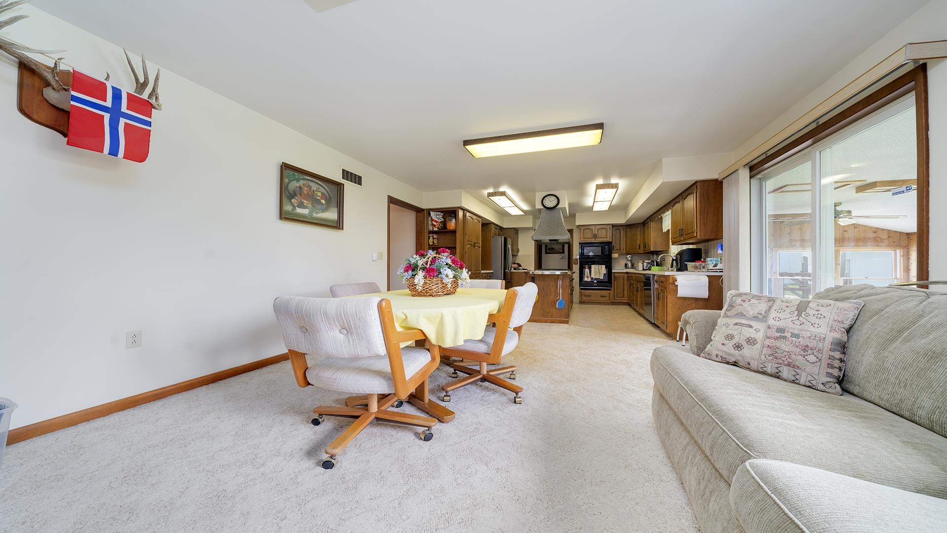10245 West Penn Corner Road Polo, IL 61064 - Photo 16 of 48 a view of a livingroom with furniture and a potted plant