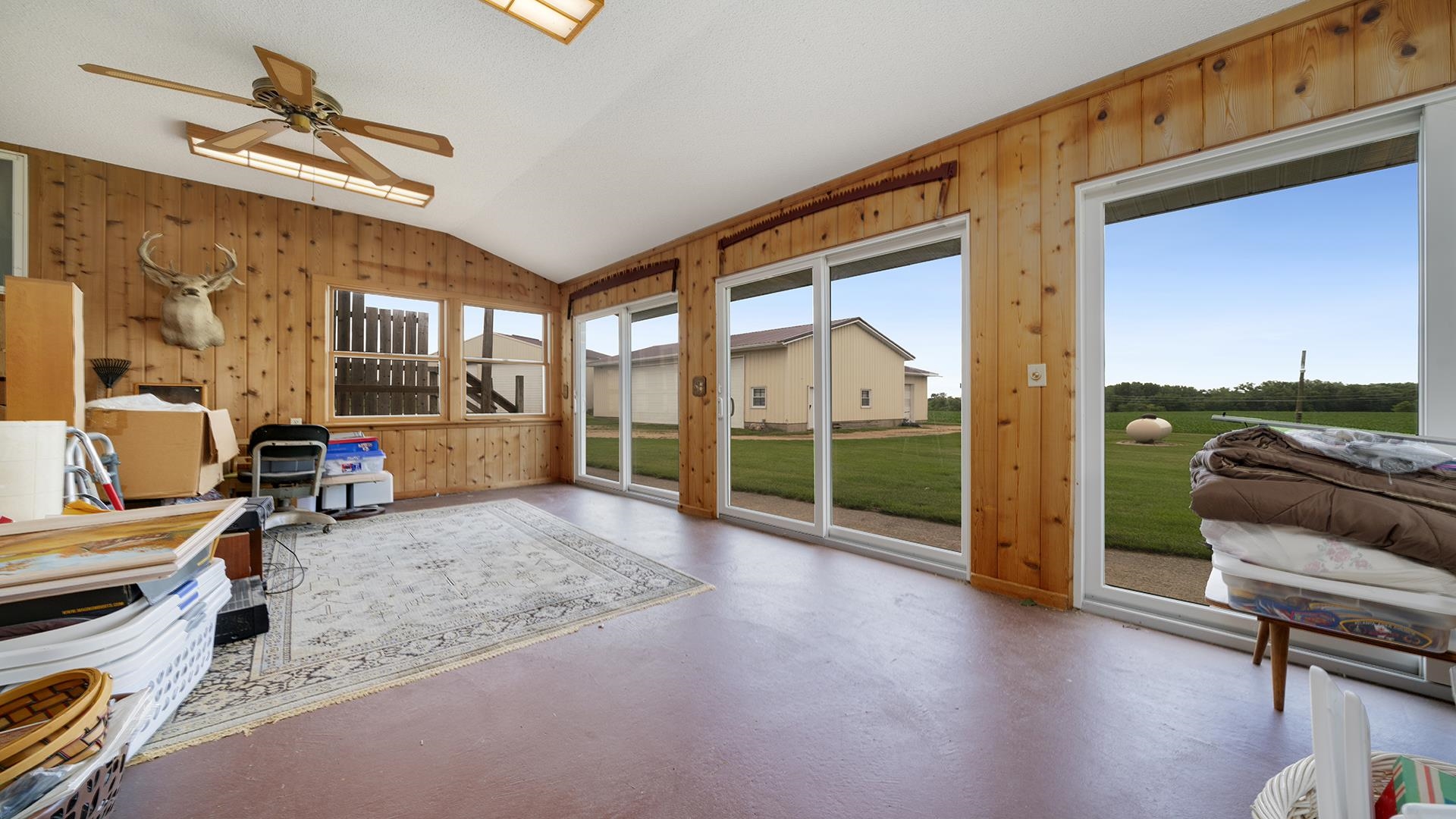 10245 West Penn Corner Road Polo, IL 61064 - Photo 17 of 48 a view of a livingroom with furniture and a floor to ceiling window