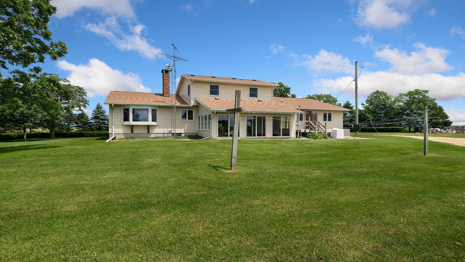 10245 West Penn Corner Road Polo, IL 61064 - Photo 37 of 48 a front view of a house with a yard