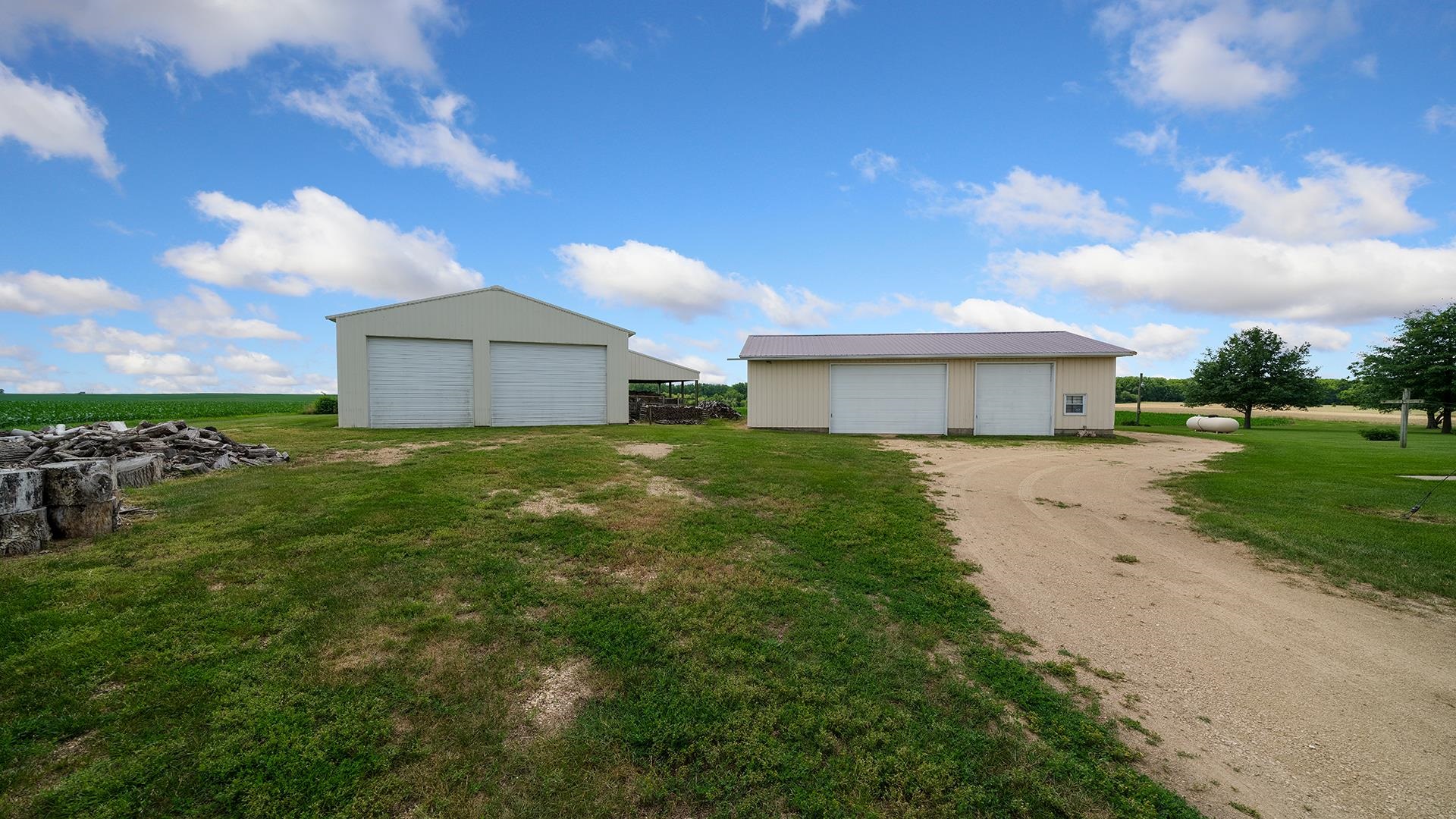 10245 West Penn Corner Road Polo, IL 61064 - Photo 39 of 48 a front view of a house with garden