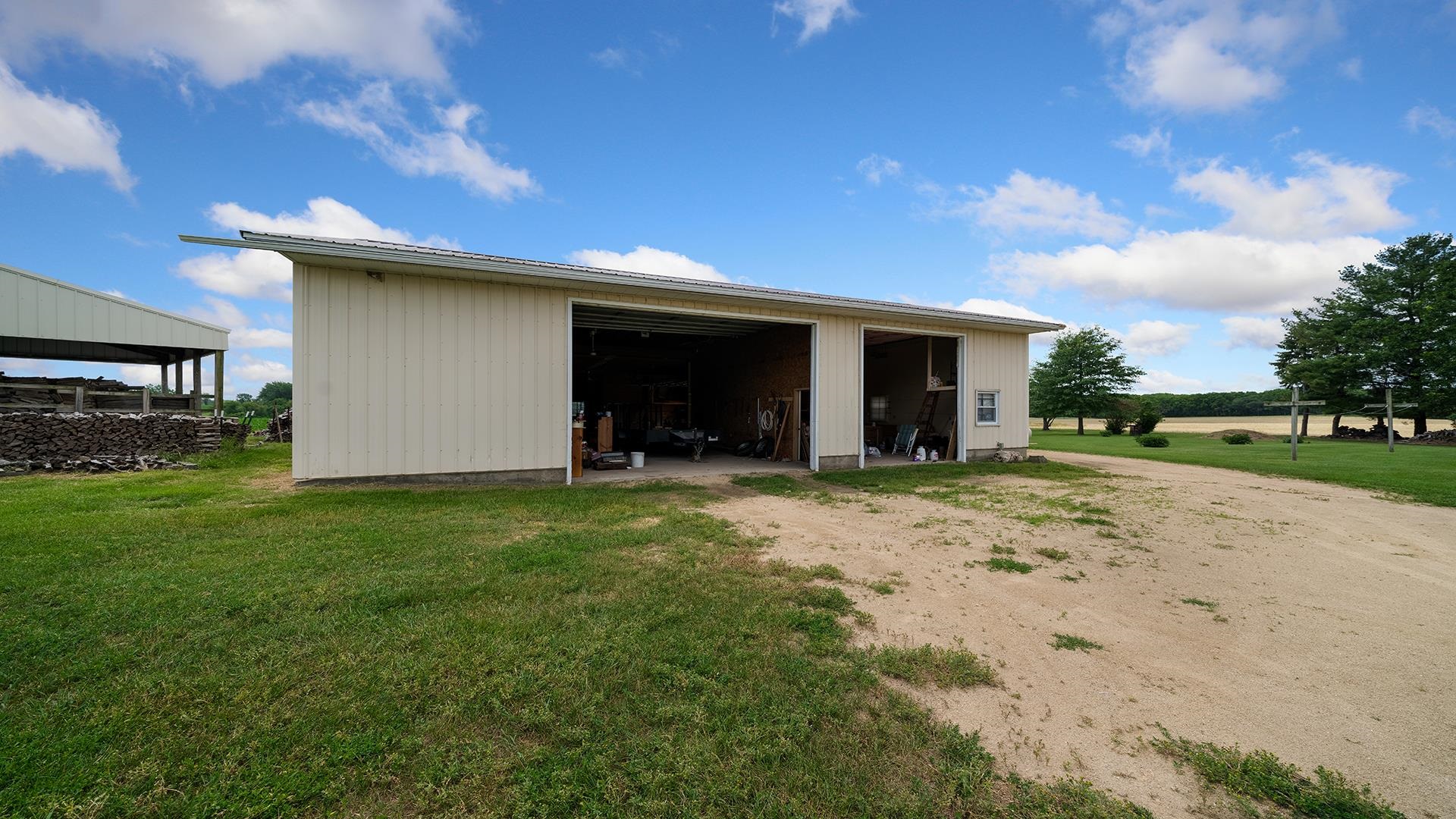 10245 West Penn Corner Road Polo, IL 61064 - Photo 40 of 48 a view of a house with backyard and porch