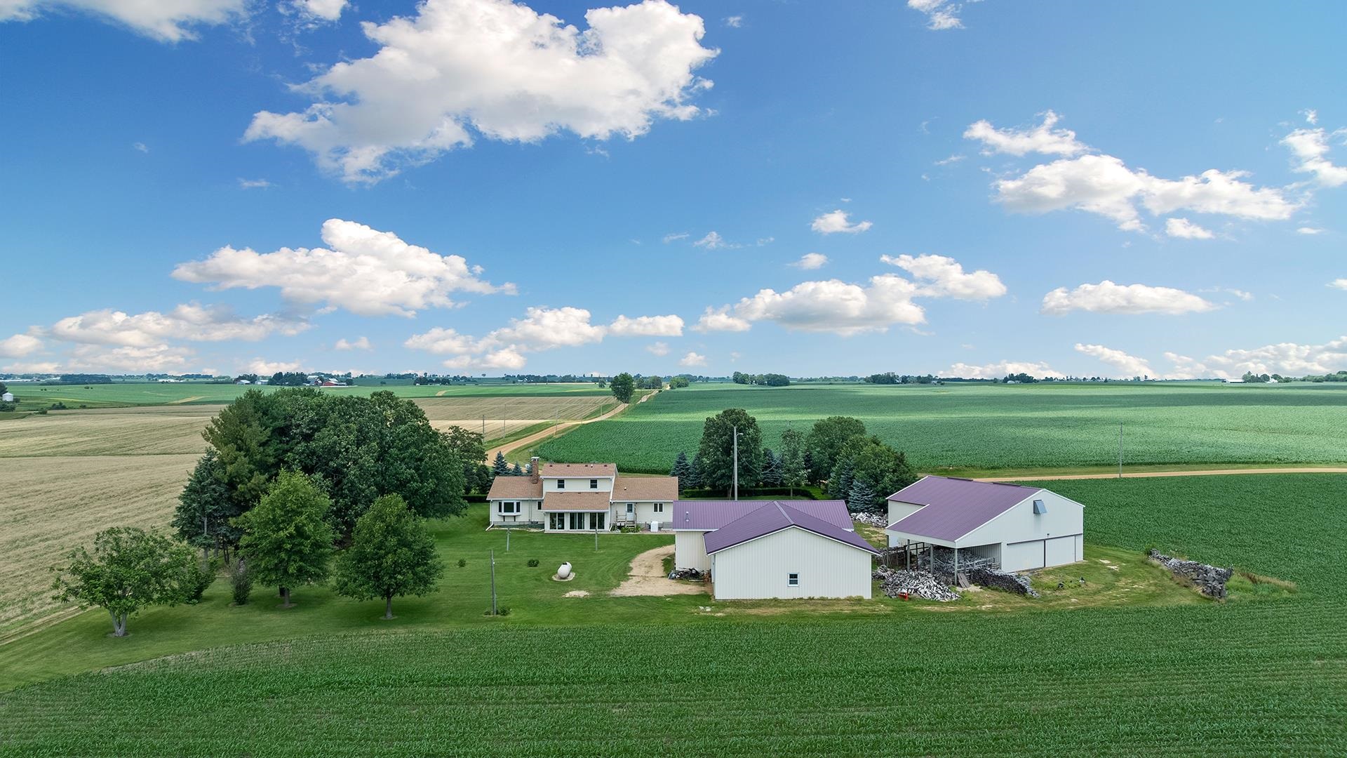 10245 West Penn Corner Road Polo, IL 61064 - Photo 47 of 48 a view of a lake with couches and large trees