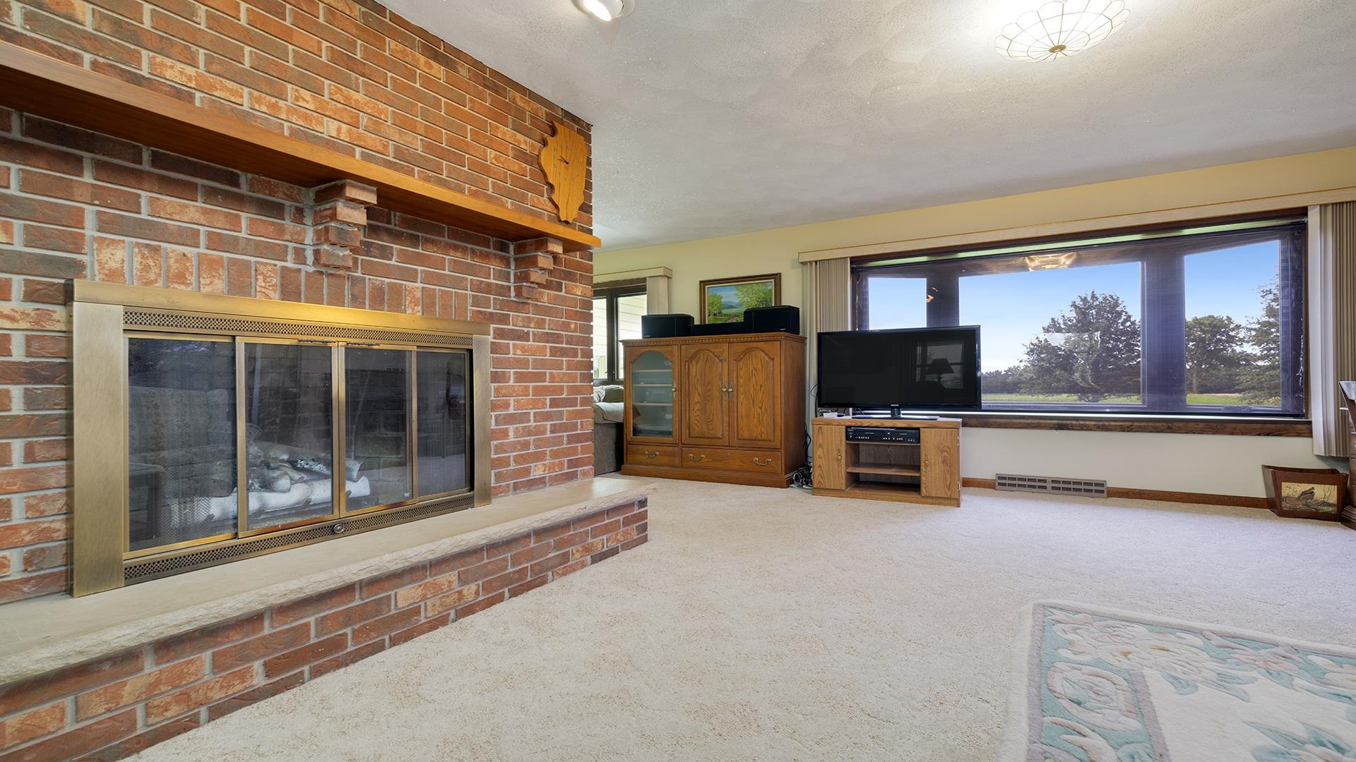 10245 West Penn Corner Road Polo, IL 61064 - Photo 7 of 48 a living room with furniture window and a flat screen tv