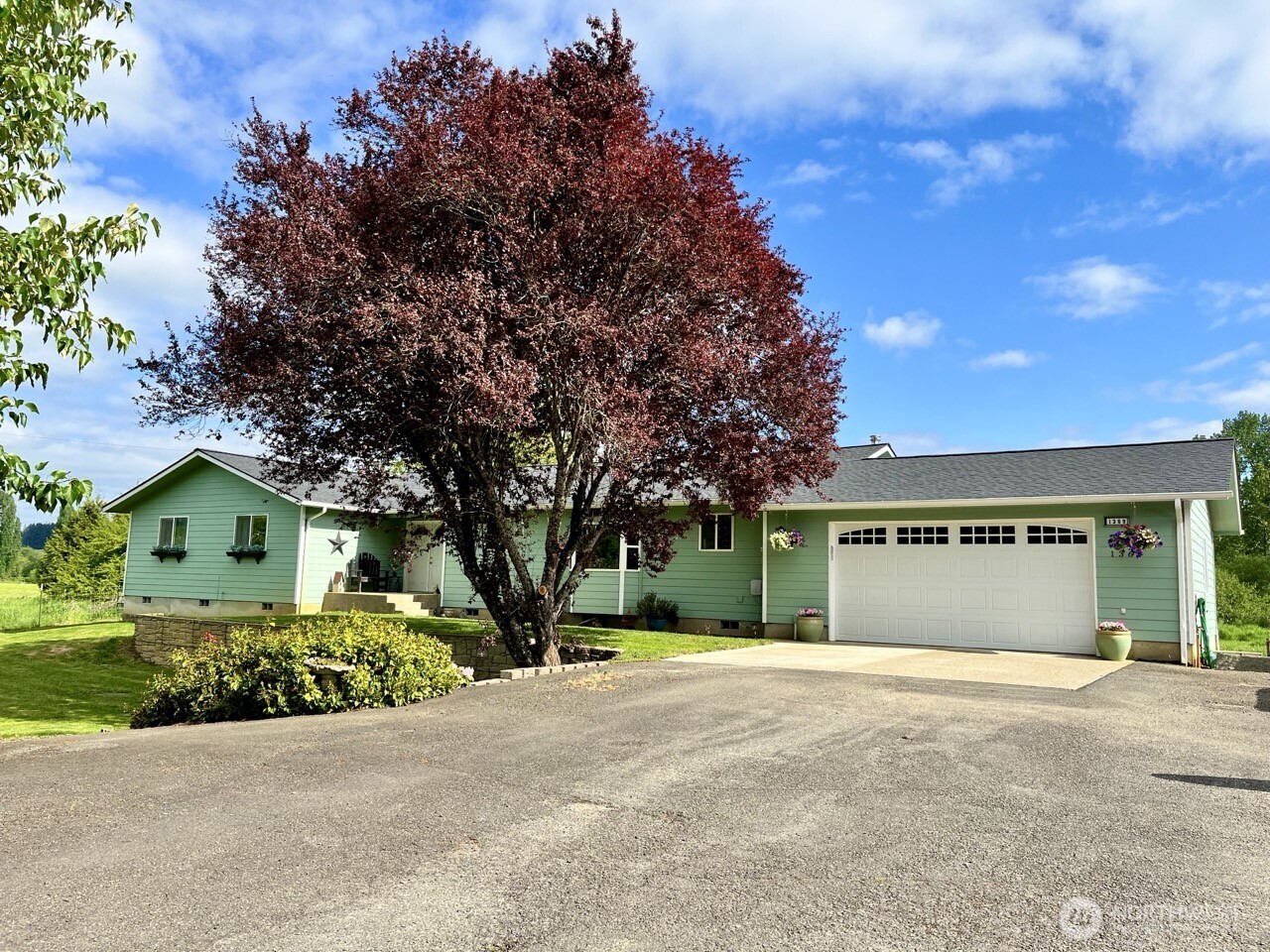 1369 SR 6 Chehalis, WA 98532 - Photo 1 of 39 a front view of a house with a garden and garage