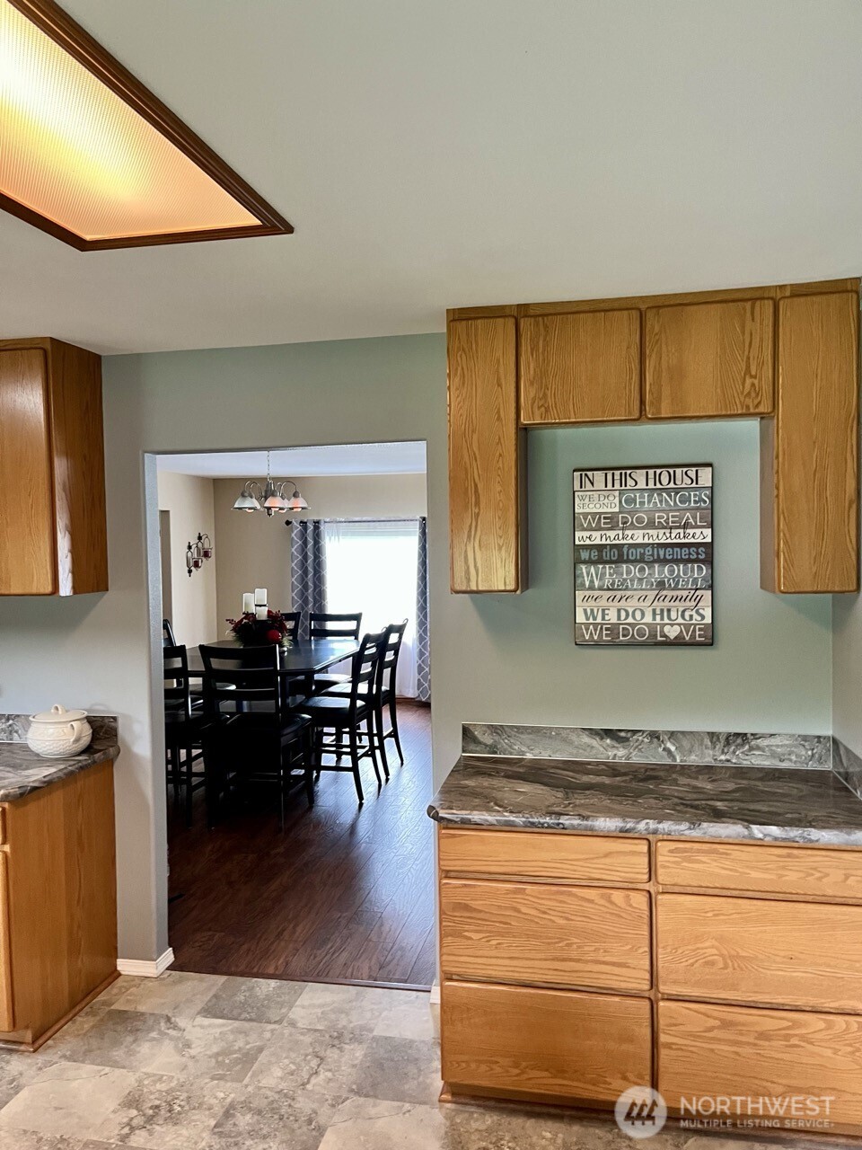 1369 SR 6 Chehalis, WA 98532 - Photo 17 of 39 a view of a kitchen with kitchen island a sink wooden floor and a counter top space