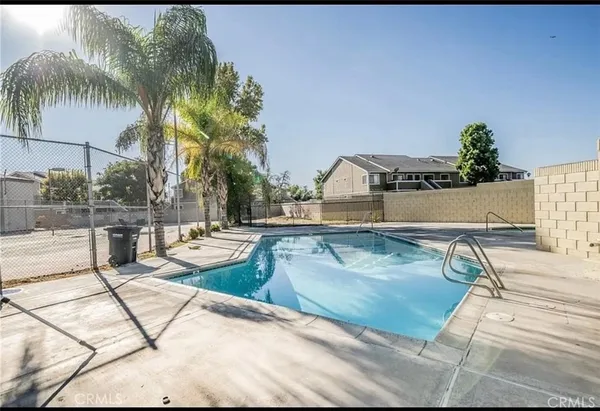 a view of swimming pool with outdoor seating