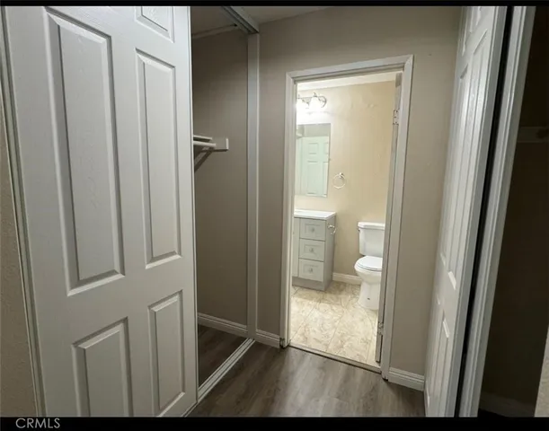 a view of a bathroom with a glass door and a bathroom