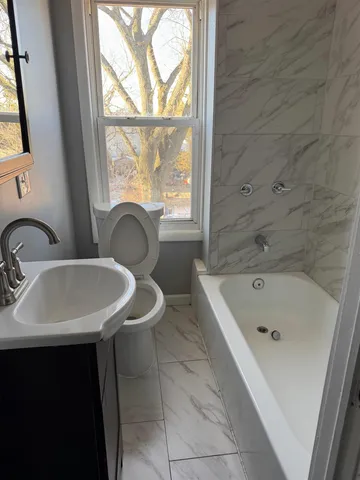 a bathroom with a sink and a bathtub