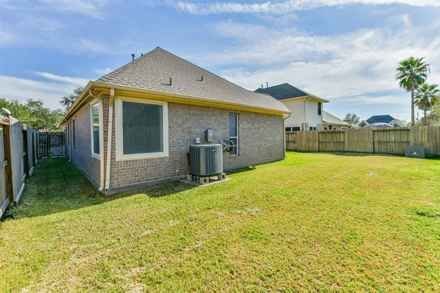 a front view of house with yard and entertaining space
