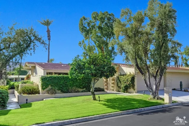 a house view with a garden space