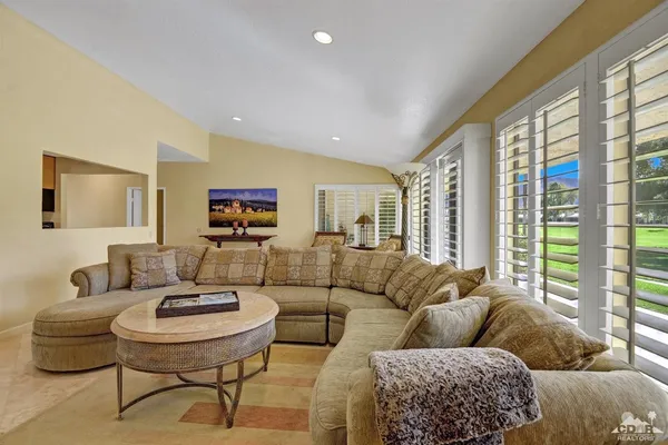 a living room with furniture and a table