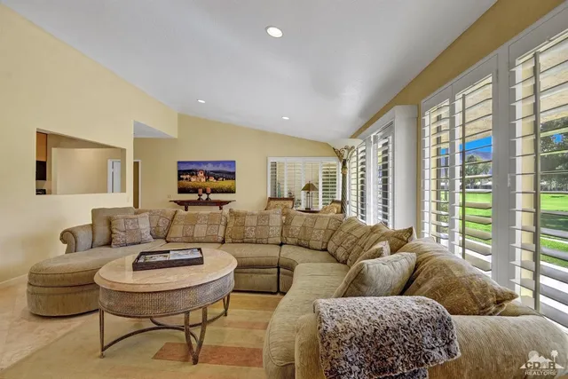a living room with furniture and a table