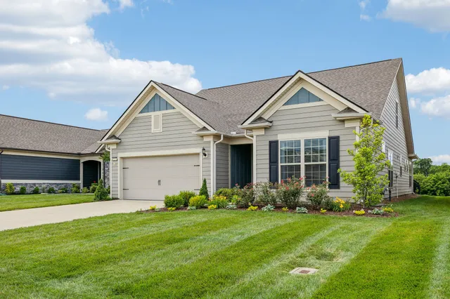 a kitchen with stainless steel appliances granite countertop sink stove and wooden floor