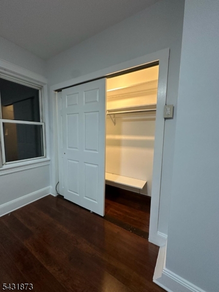 32 Hamilton Avenue, Unit 2 Fairview, NJ 07022 - Photo 18 of 30 a view of an empty room with wooden floor and a window