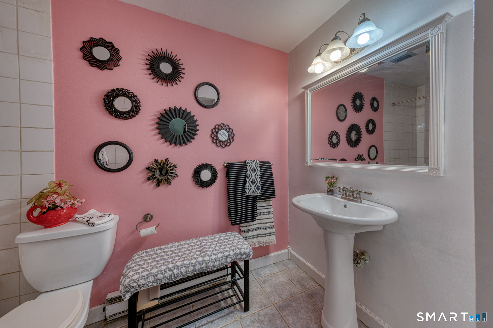 17 Hemlock Court, Unit 17 Cromwell, CT 06416 - Photo 27 of 36 a bathroom with a sink mirror and toilet