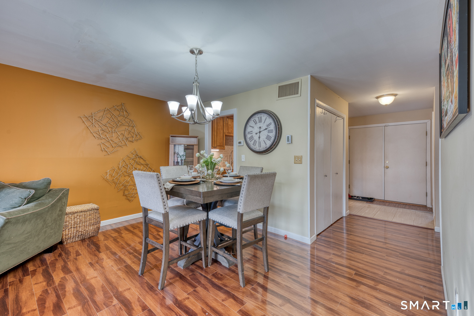 17 Hemlock Court, Unit 17 Cromwell, CT 06416 - Photo 4 of 36 a view of a dining room with furniture and a chandelier