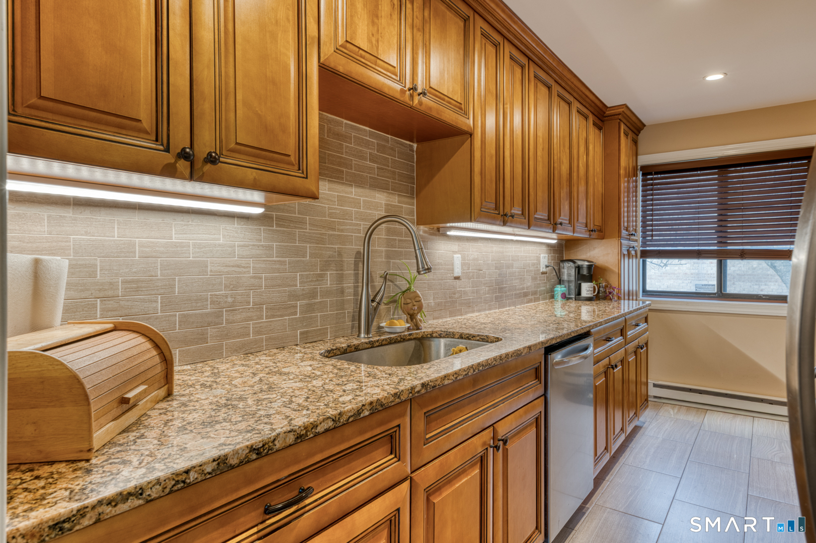 17 Hemlock Court, Unit 17 Cromwell, CT 06416 - Photo 9 of 36 a kitchen with stainless steel appliances granite countertop a sink and a counter space