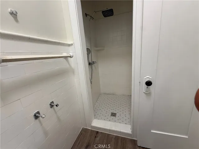 a bathroom with a tub and shower