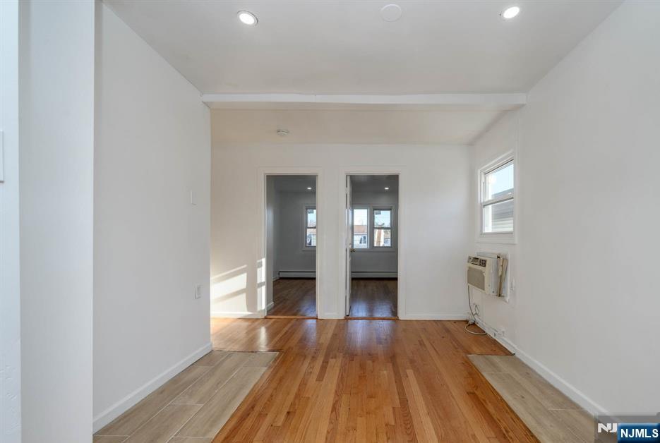 49 River Street, Unit 2 Lodi, NJ 07644 - Photo 14 of 24 a view of empty room with wooden floor and fan