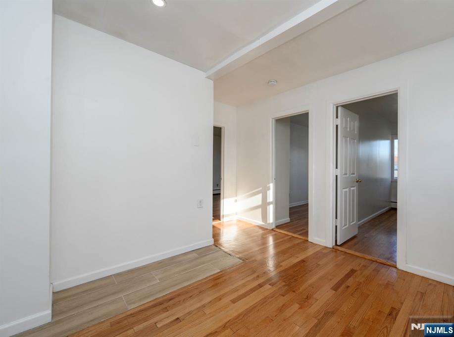 49 River Street, Unit 2 Lodi, NJ 07644 - Photo 15 of 24 a view of empty room with wooden floor