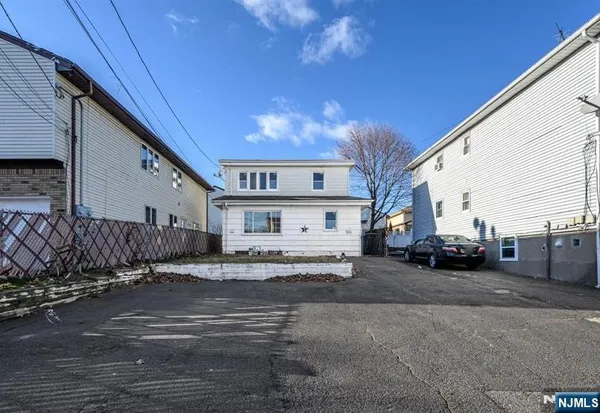 a view of a car park in front of house