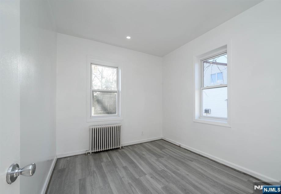 49 River Street, Unit 2 Lodi, NJ 07644 - Photo 9 of 24 an empty room with a window