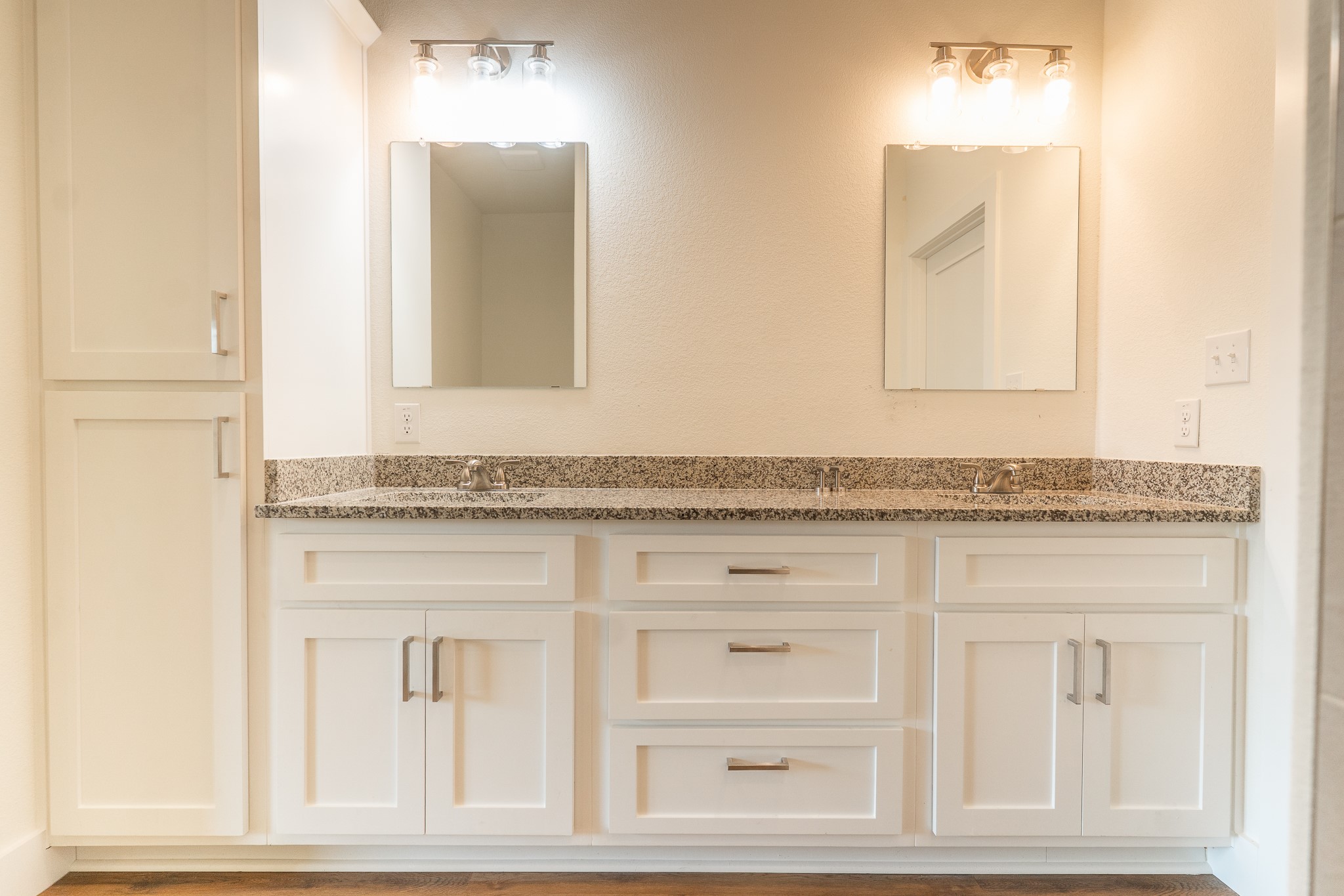 309 String Prairie Way Smithville, TX 78957 - Photo 16 of 30 a bathroom with a granite countertop sink and a mirror