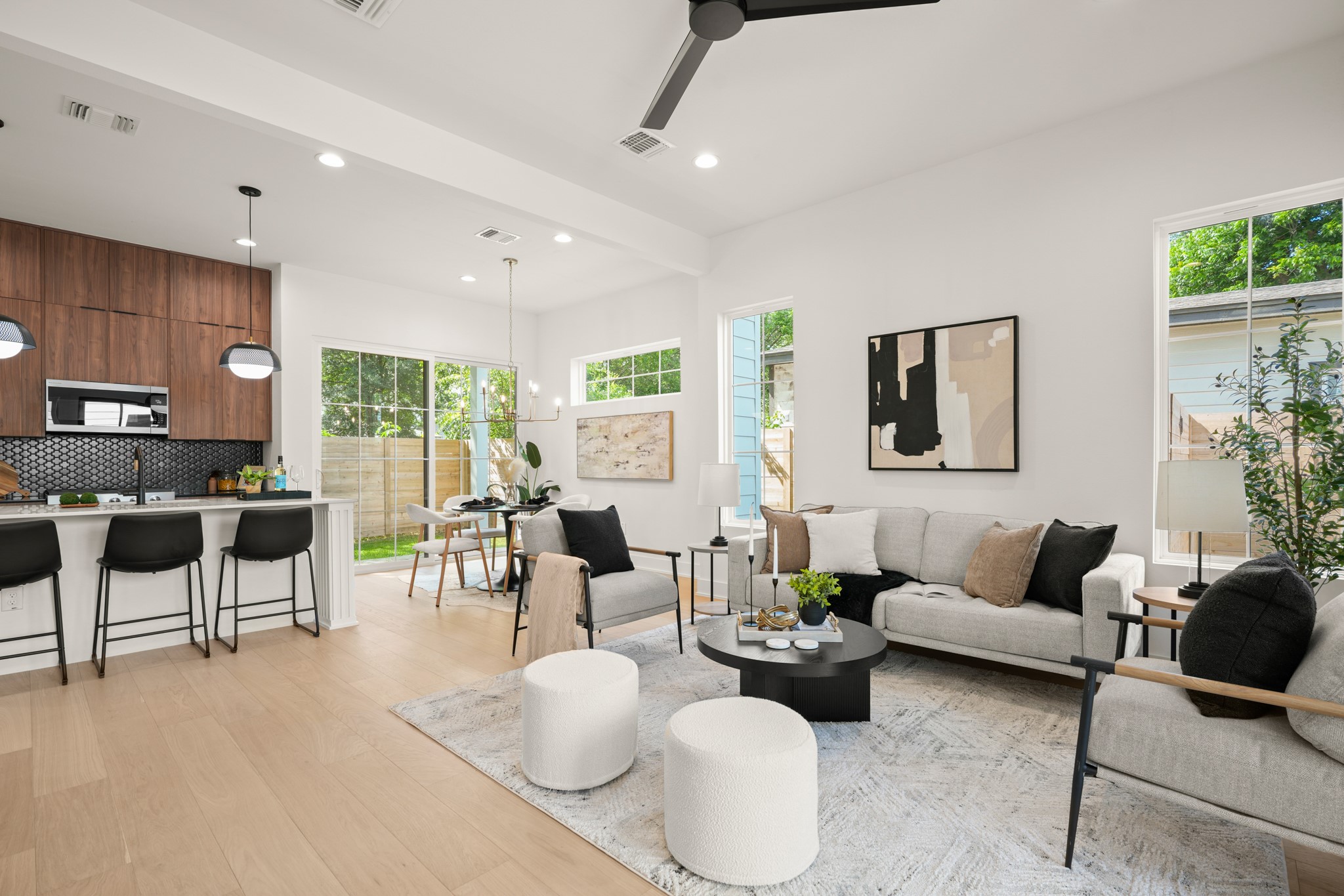 601 Vermont Road, Unit 2 Austin, TX 78702 - Photo 5 of 31 An airy living space unfolds, connecting to the kitchen, bathed in natural light through ample windows.