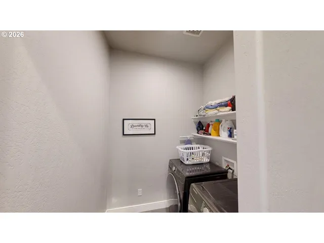a bathroom with a sink tub and mirror