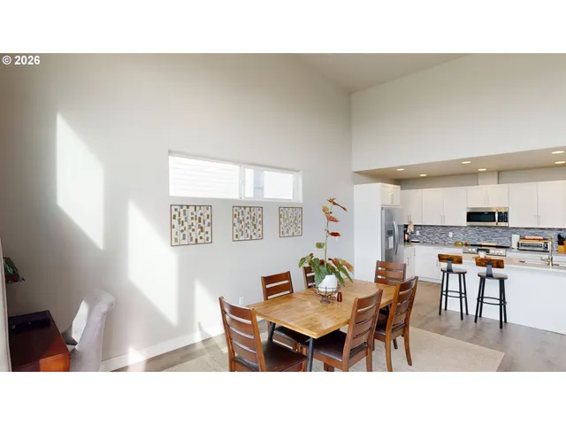 a kitchen with a dining table and chairs