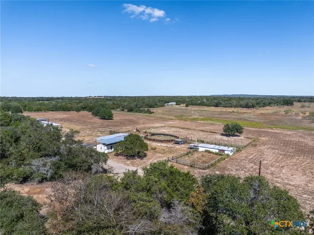 a view of a lake with houses with yard
