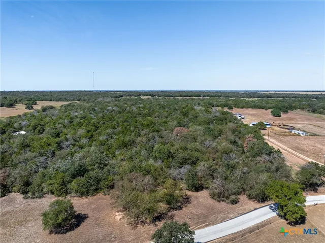 a view of a lake with a yard