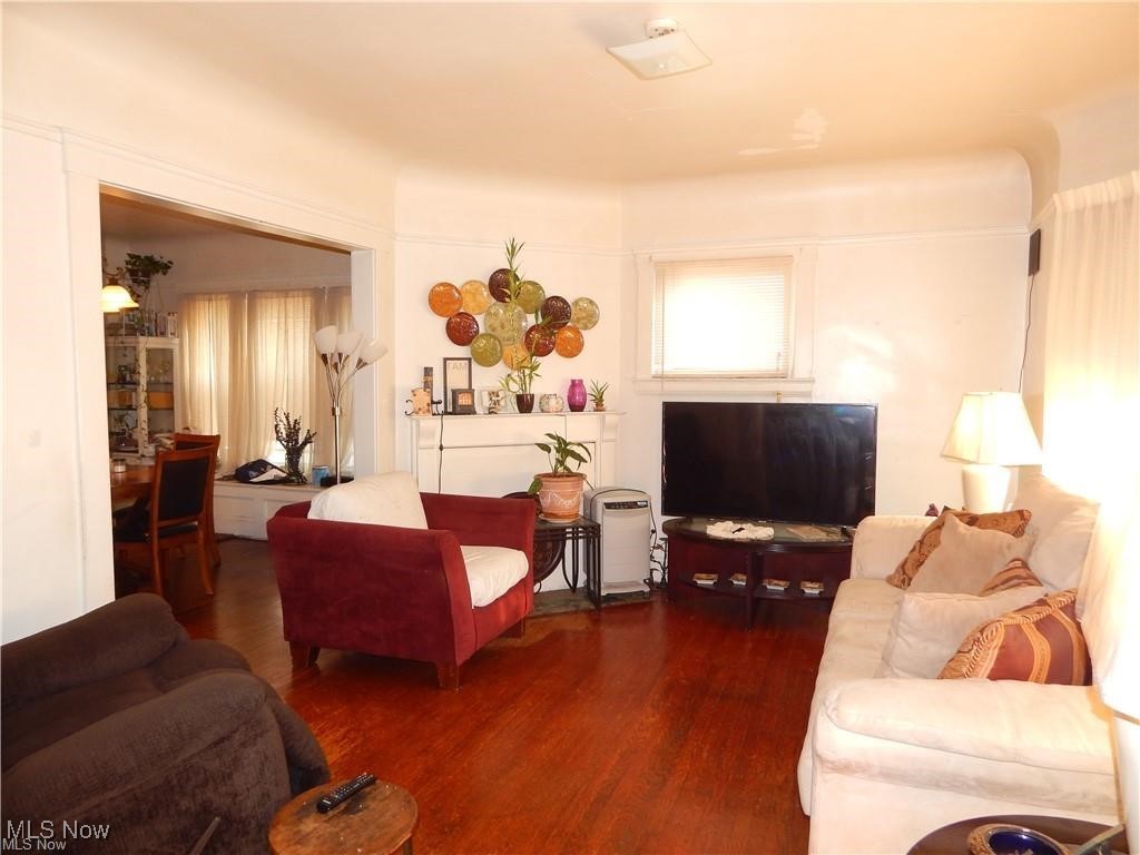 Living room with dark hardwood / wood flooring