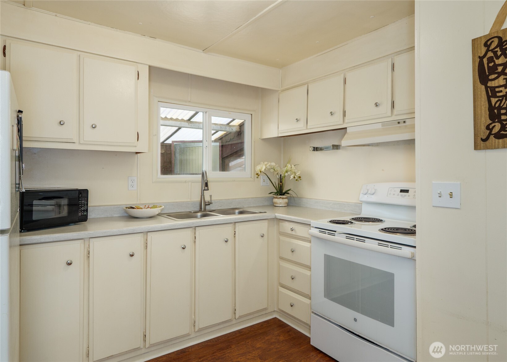 201 North 5th Avenue, Unit 19 Sequim, WA 98382 - Photo 14 of 25 a kitchen with granite countertop white cabinets and white appliances