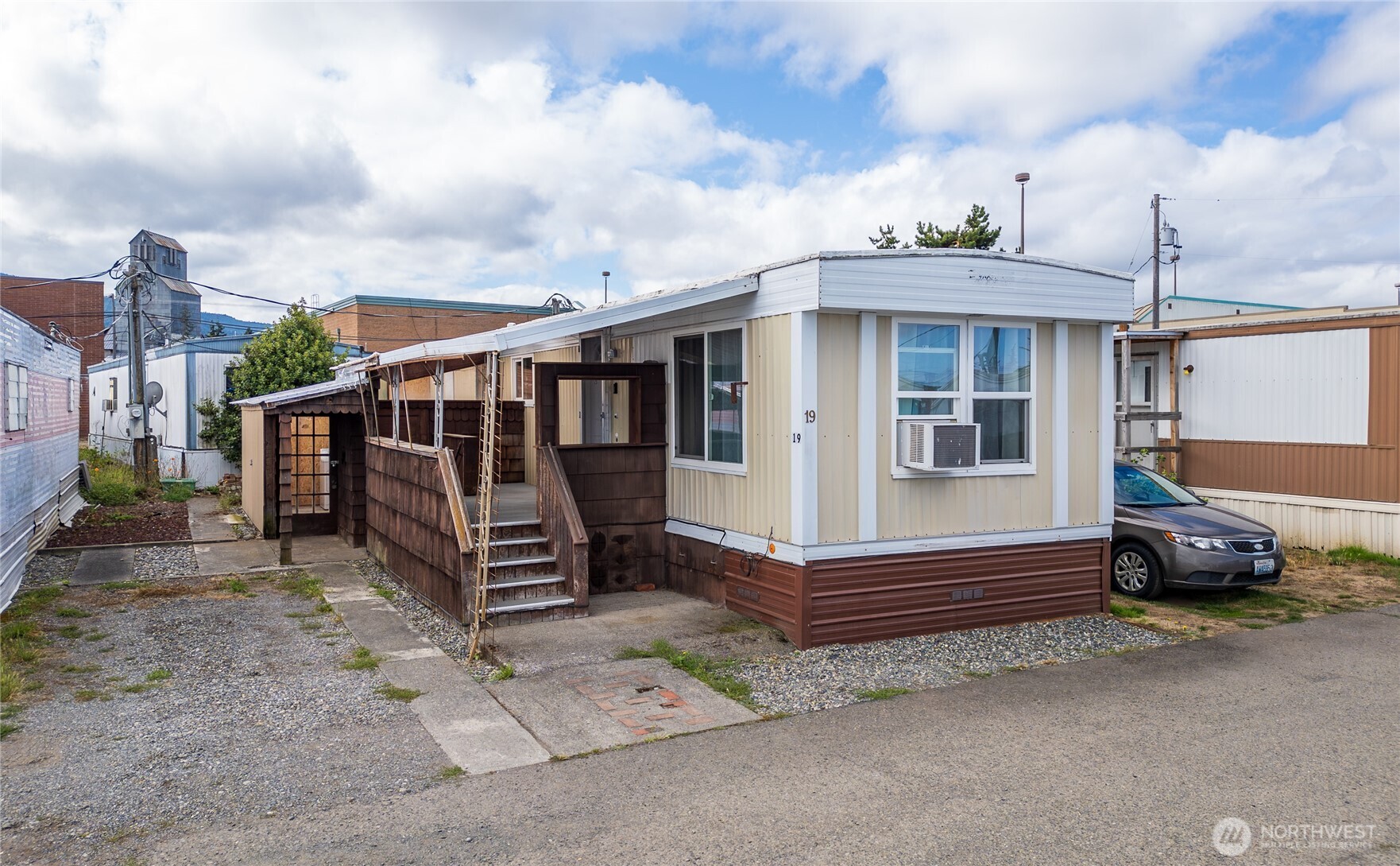 201 North 5th Avenue, Unit 19 Sequim, WA 98382 - Photo 20 of 25 a view of a house with a yard and wooden fence